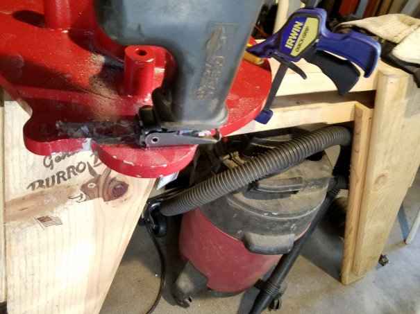 Sawzall removing "starter ear" from adapter plate.